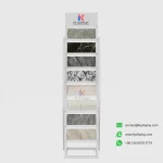 Front view of KYdisplay curved steel tile display stand showcasing 16 quartz and granite tile samples on white background